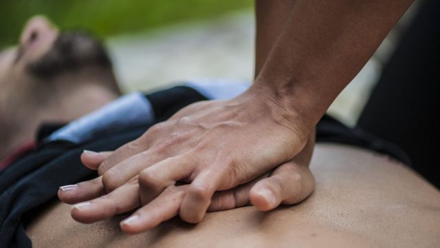 A man receives CPR cardiopulmonary resuscitation