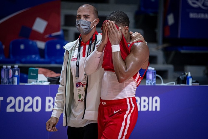 National team general manager Carlos Arroyo comforts point guard Gary Browne during a moment of frustration.