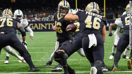 New Orleans Saints quarterback Ian Book (16) surrenders to New Orleans Saints fullback Adam Prentice (46) in his own end zone during the second half of the action.