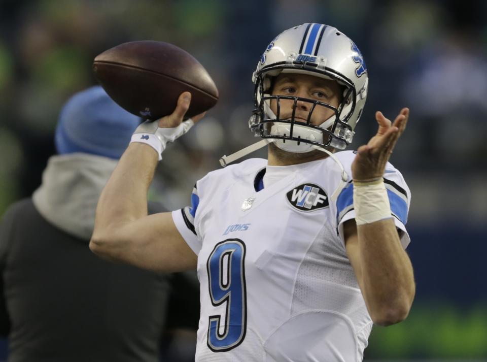 Detroit Lions quarterback Matthew Stafford wears a finger guard as he passes the ball in warmups before Saturday's NFL postseason game against the Seattle Seahawks January 7, 2017 in Seattle.  (AP Photo/Stephen Brashear)