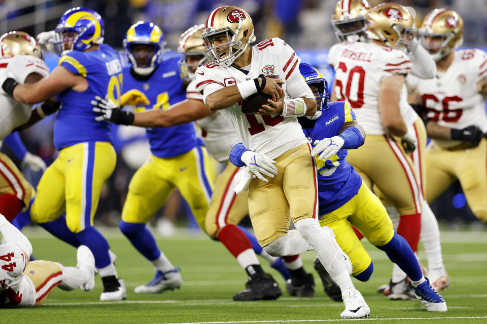INGLEWOOD, CALIFORNIA - Obo Okoronkwo #45 of the Los Angeles Rams pressures Jimmy Garoppolo #10 of the San Francisco 49ers in the third quarter of the NFC Championship game at SoFi Stadium on January 30, 2022 in Inglewood, California.  (Photo by Christian Petersen/Getty Images)