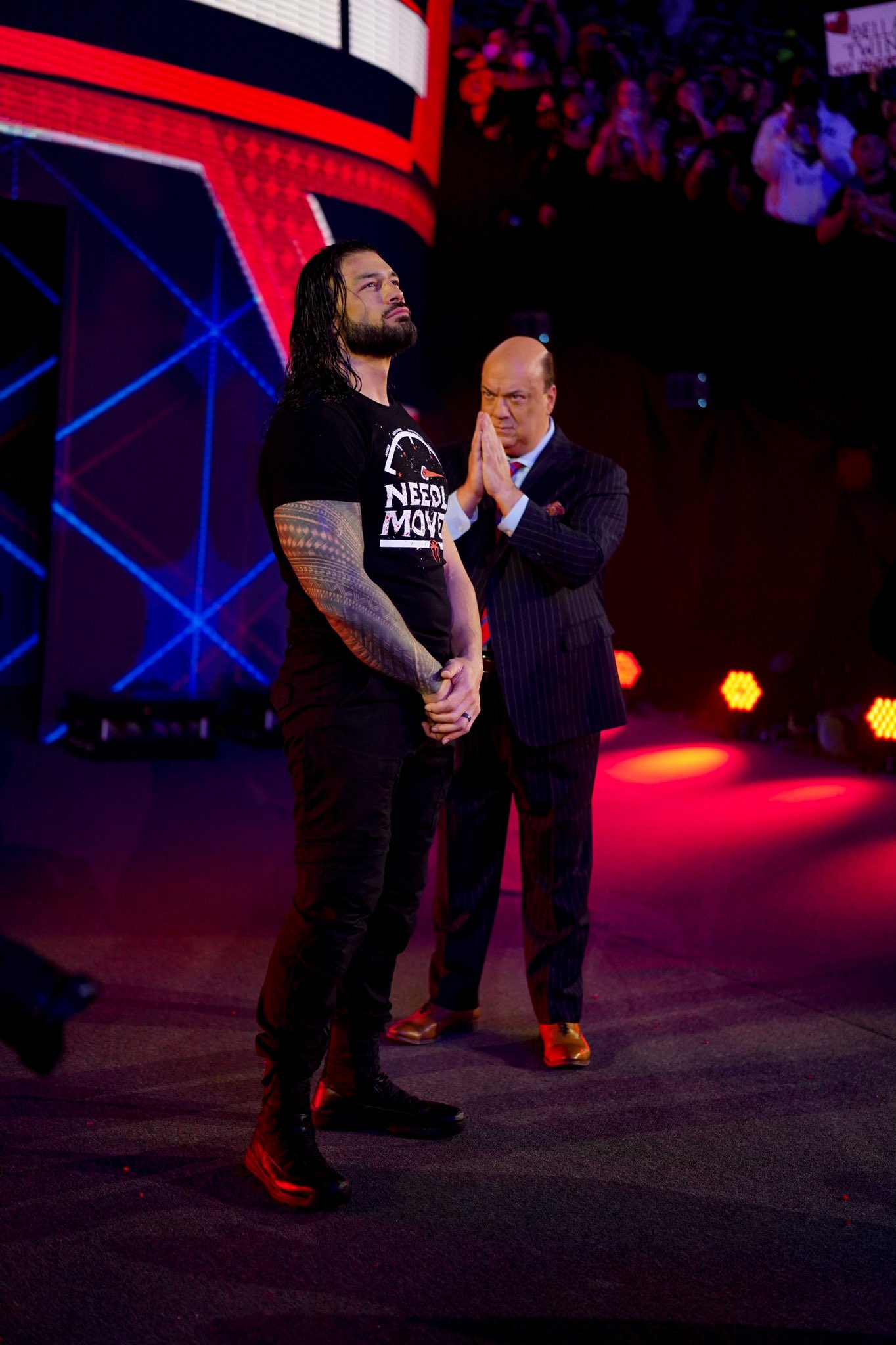 Roman Reigns and Paul Heyman leaving Royal Rumble 2022 after attacking Brock Lesnar