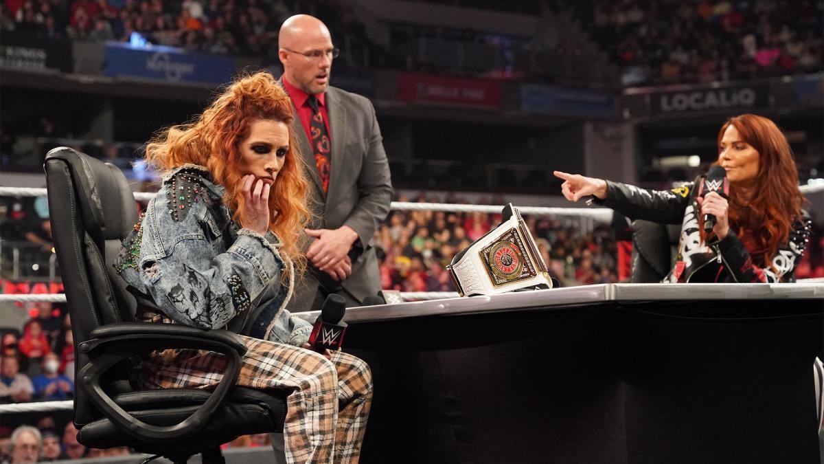 Lita and Becky Lynch sign the contract for their title