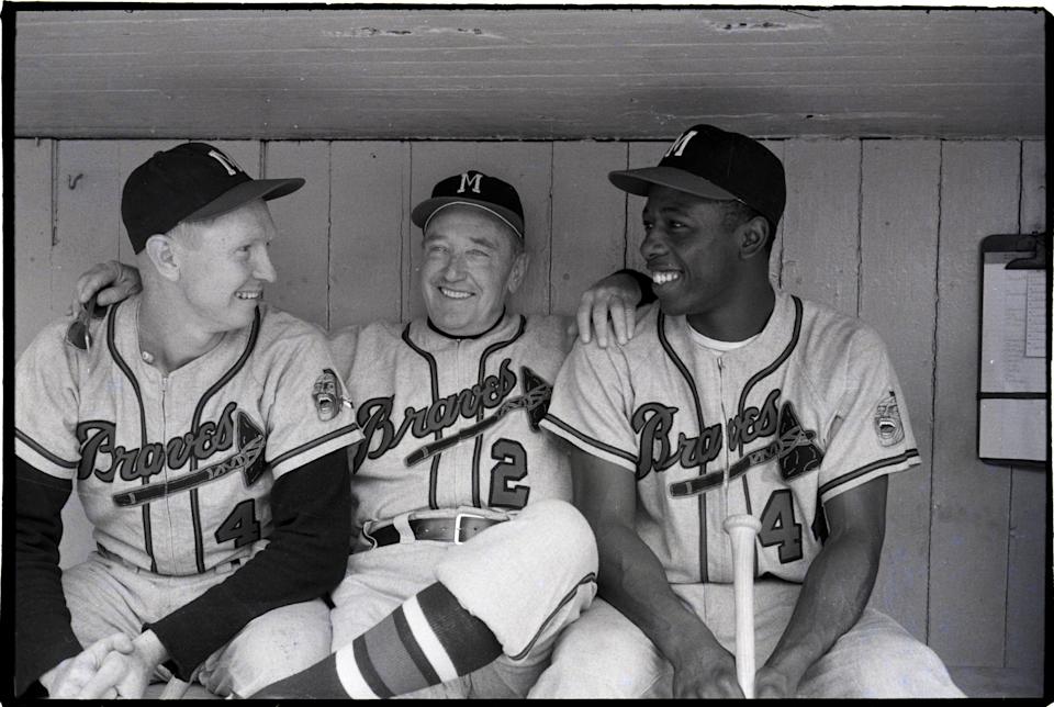 (Original caption) October 1975: Atlanta Braves players await the start of the 1957 World Series. The players are (from left to right) Red Schaendienst, Fred Glaney and Hank Aaron.