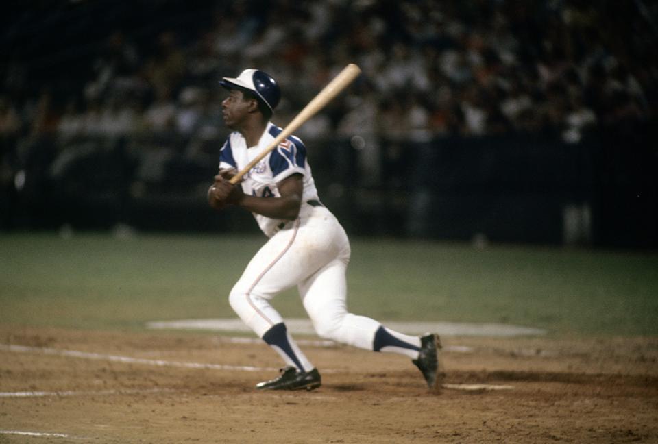 ATLANTA, Georgia - Approximately 1974: Atlanta Braves outfielder Hank Aaron #44 swings and watches the ball fly in a 1974 Major League Baseball game at Atlanta Fulton County Stadium in Atlanta, Georgia.  (Photo by Focus on Sport/Getty Images)