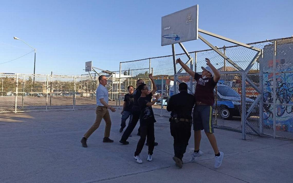 Cops vs youngsters face off in a basketball shell in