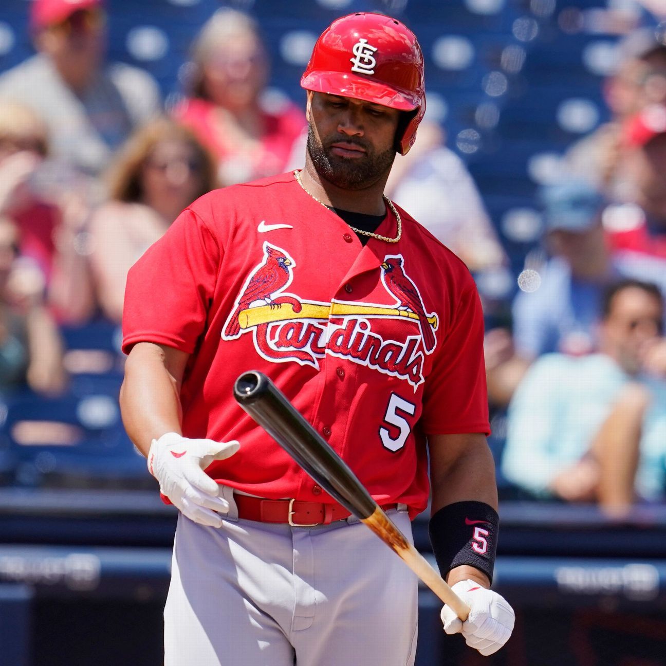 Pujols debuts with Cardinals his wife comes out of surgery