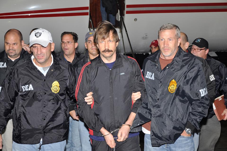 Russian arms dealer Viktor Bout is escorted by Drug Enforcement Administration (DEA) officers after being extradited to the US in late 2010. Bout is known as the