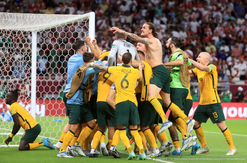Photo of the Australian soccer players celebrating after qualifying for the Qatar 2022 World Cup