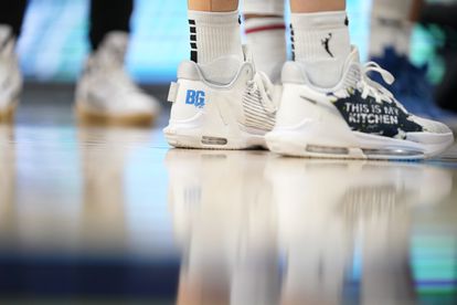 Marina Mabrey of the Dallas Wings wears sneakers with the letters BG, in honor of Griner.