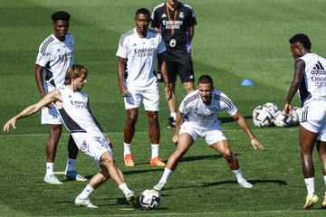 Modric attempts a pass during Real Madrid training.