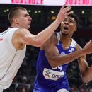 France and Slovenia advance to the quarterfinals Doncic ends with